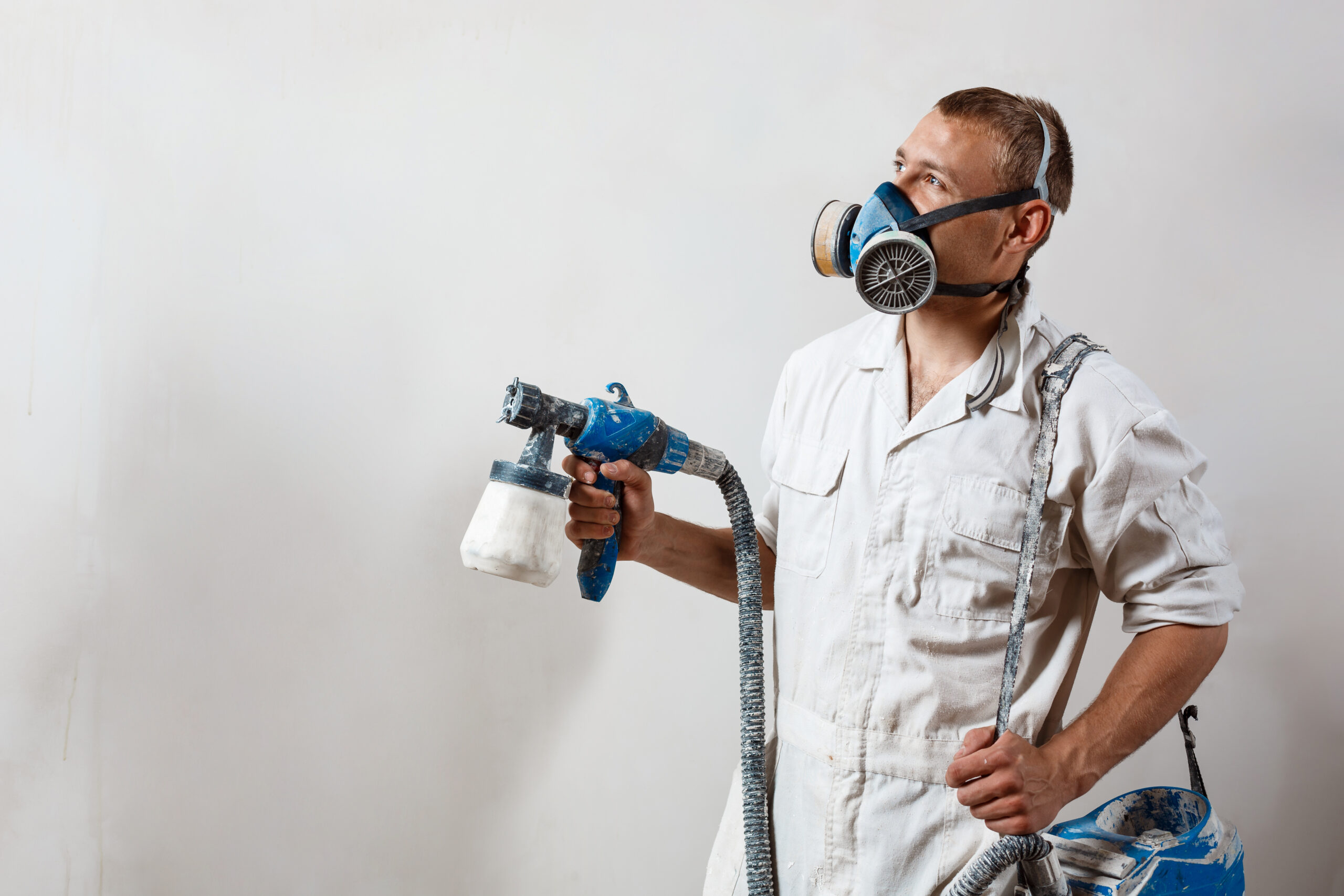Worker painting wall